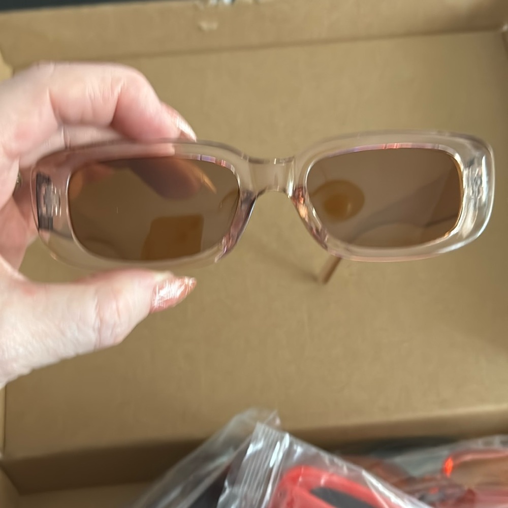 Clear frames with brown lenses.